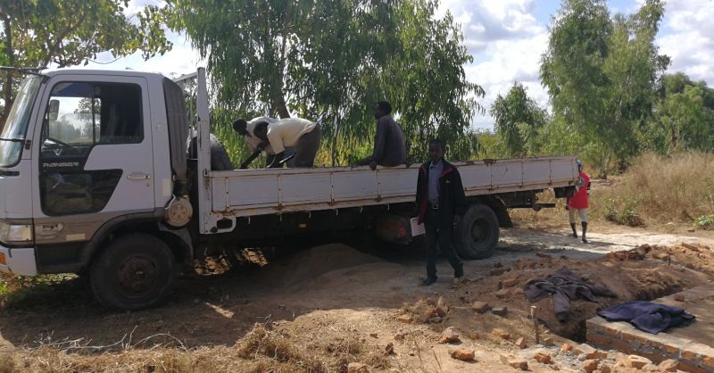 Truck being unloaded