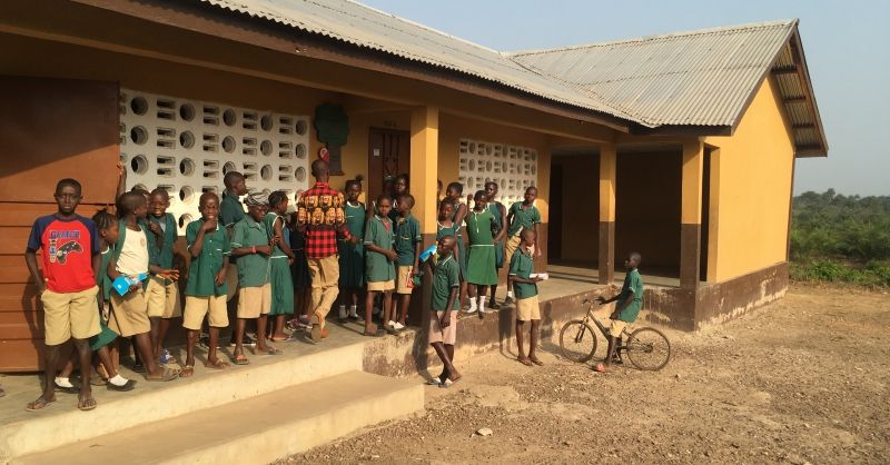 Children in front of school building