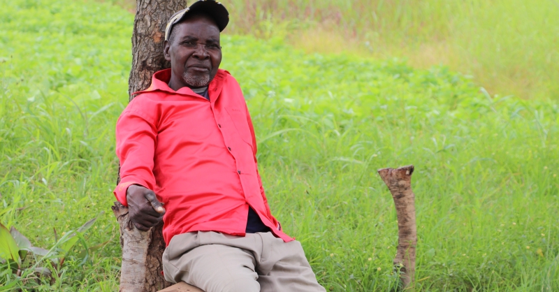 The chief smiling while looking at the visitors