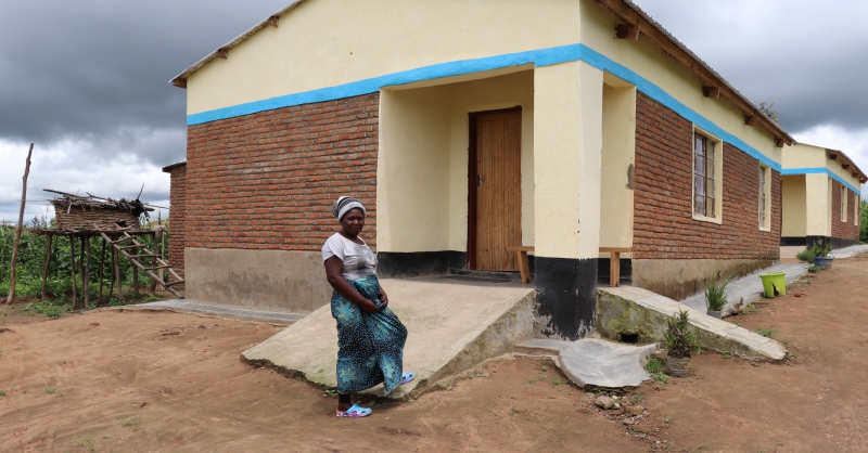 Lady teacher in front of her house