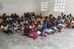 Older children sitting on the classroom floor