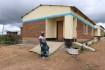 Lady teacher in front of her house