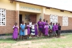 Learners posing outside their school